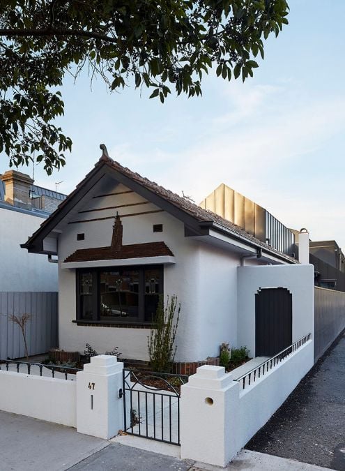 This photograph showcases a modern replica of the original house, which exhibits a simple and cohesive sculpted design, in keeping with the original style.