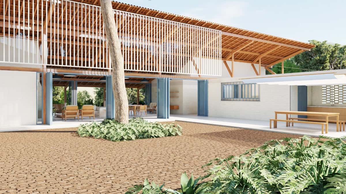 The house seamlessly connects to the outside through the folding glass doors.