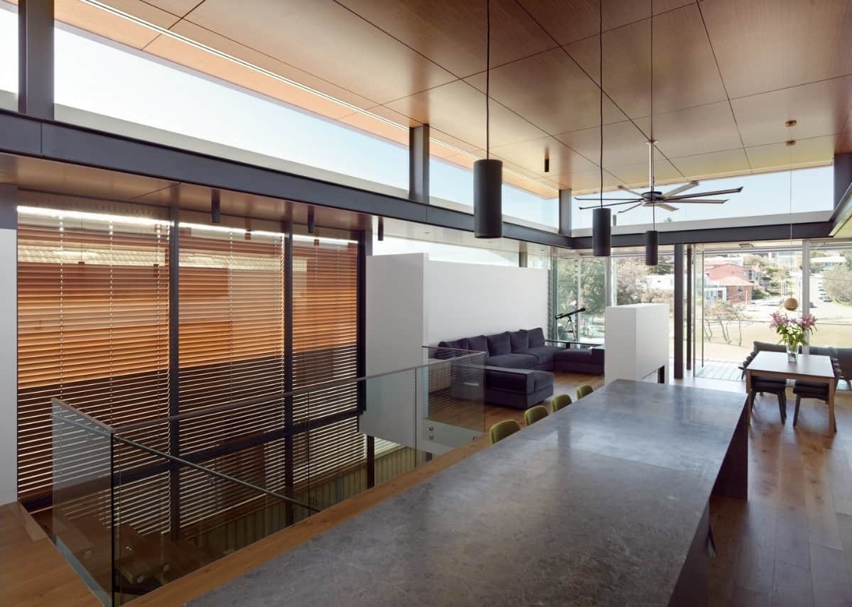 Inside, an open floor plan unites the living room, dining area, and kitchen.