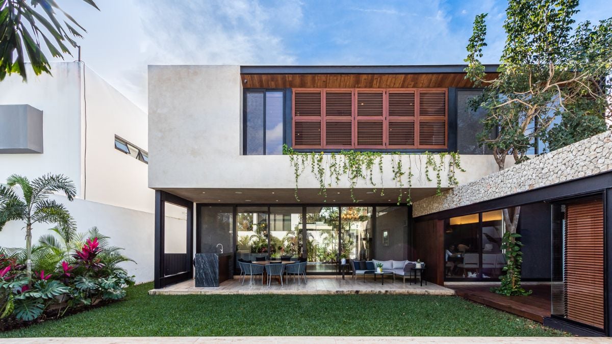 This photograph highlights the house's flexible outdoor living area, which features a space that can be adapted for exercise, gaming, or other activities.