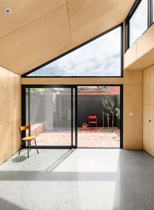 This photograph features the spacious living area, with an expansive sliding glass door that provides a view of the outdoor area.