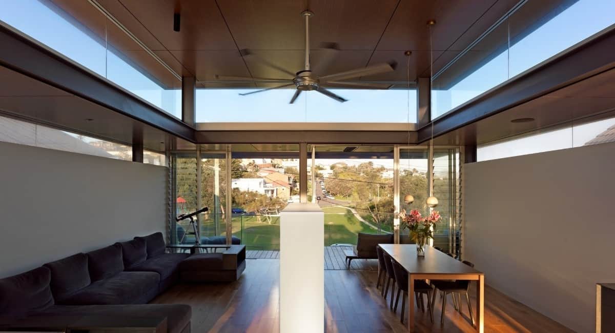 The double-sided fireplace serves as a divider between the living room and dining area.