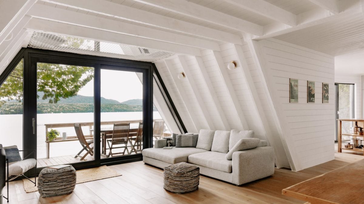 An interior view of the cabin-style house, featuring a minimalist living area.