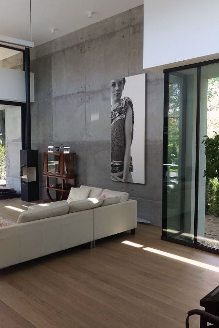 This interior shot of a section of the living room highlights the elevated ceiling and the distinctive gray wall color.