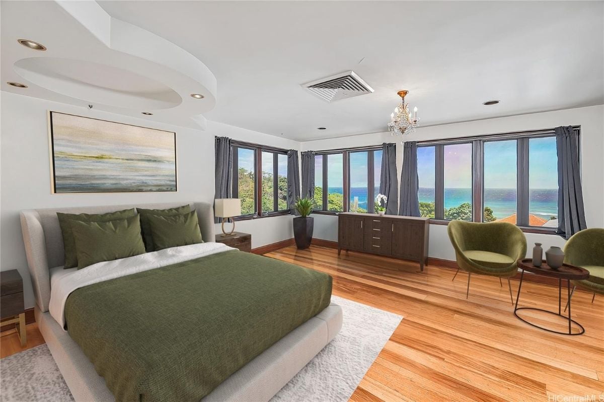 The master bedroom features a queen size bed and a bedroom seat.