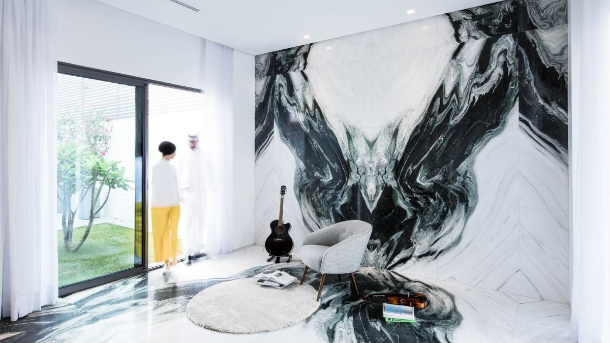 The spacious room features a large wall decor art depicting a character.