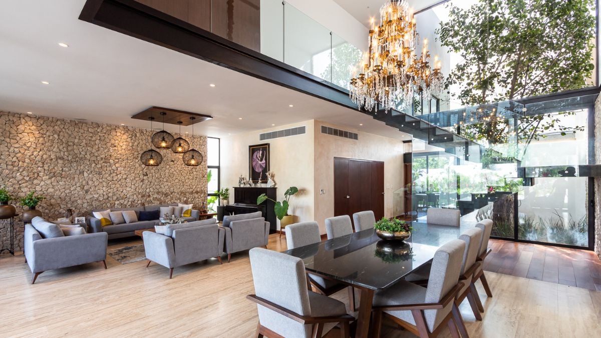 This photograph captures the beauty and functionality of the house's living and dining spaces, with a seamless integration that creates a harmonious and inviting environment. The elegant furnishings and tasteful decor contribute to the overall ambiance of the house.