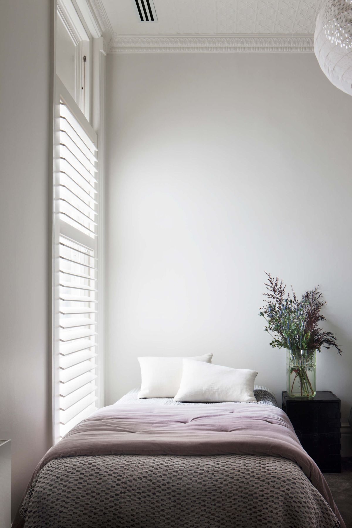 The kid's bedroom features retractable shutters that regulate sunlight.