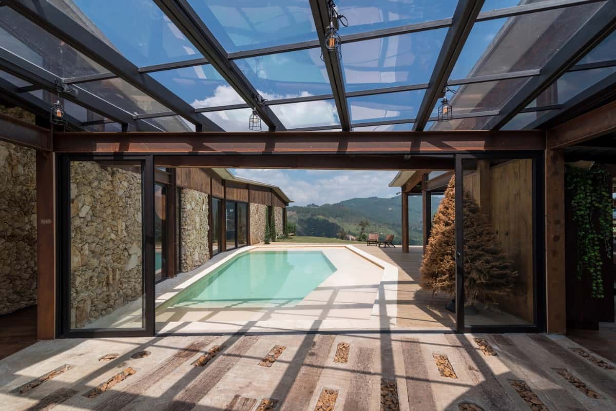 Sliding glass doors and skylights blur the line between indoor and outdoor living.