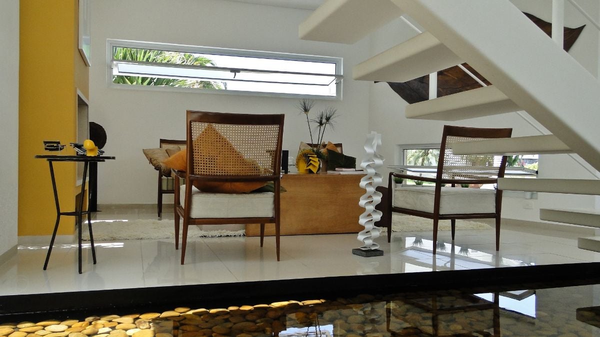 The view of the fireplace area under the floating staircase.