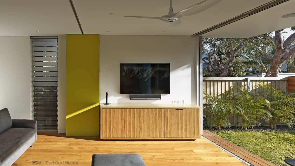 The lower-level sitting area flows seamlessly onto the garden.