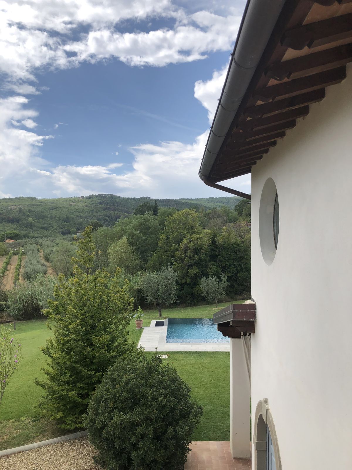 The house overlooks the beautiful surroundings and the swimming pool.
