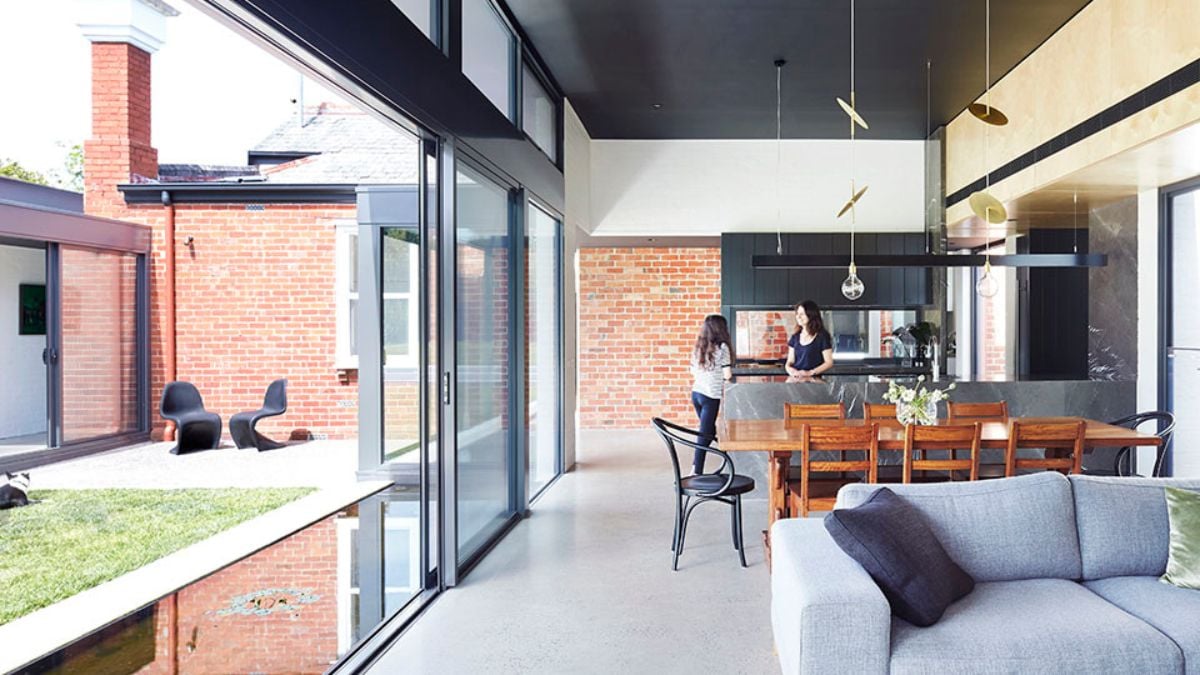 This interior photograph highlights the shared kitchen and dining room within the living room.