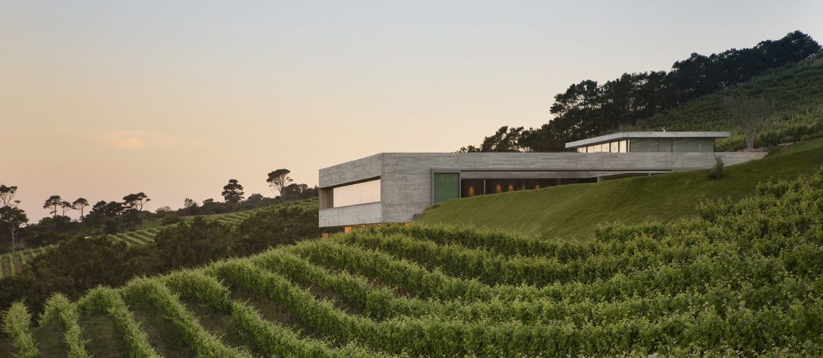 A sculpted cubic house located on a mountain slope.