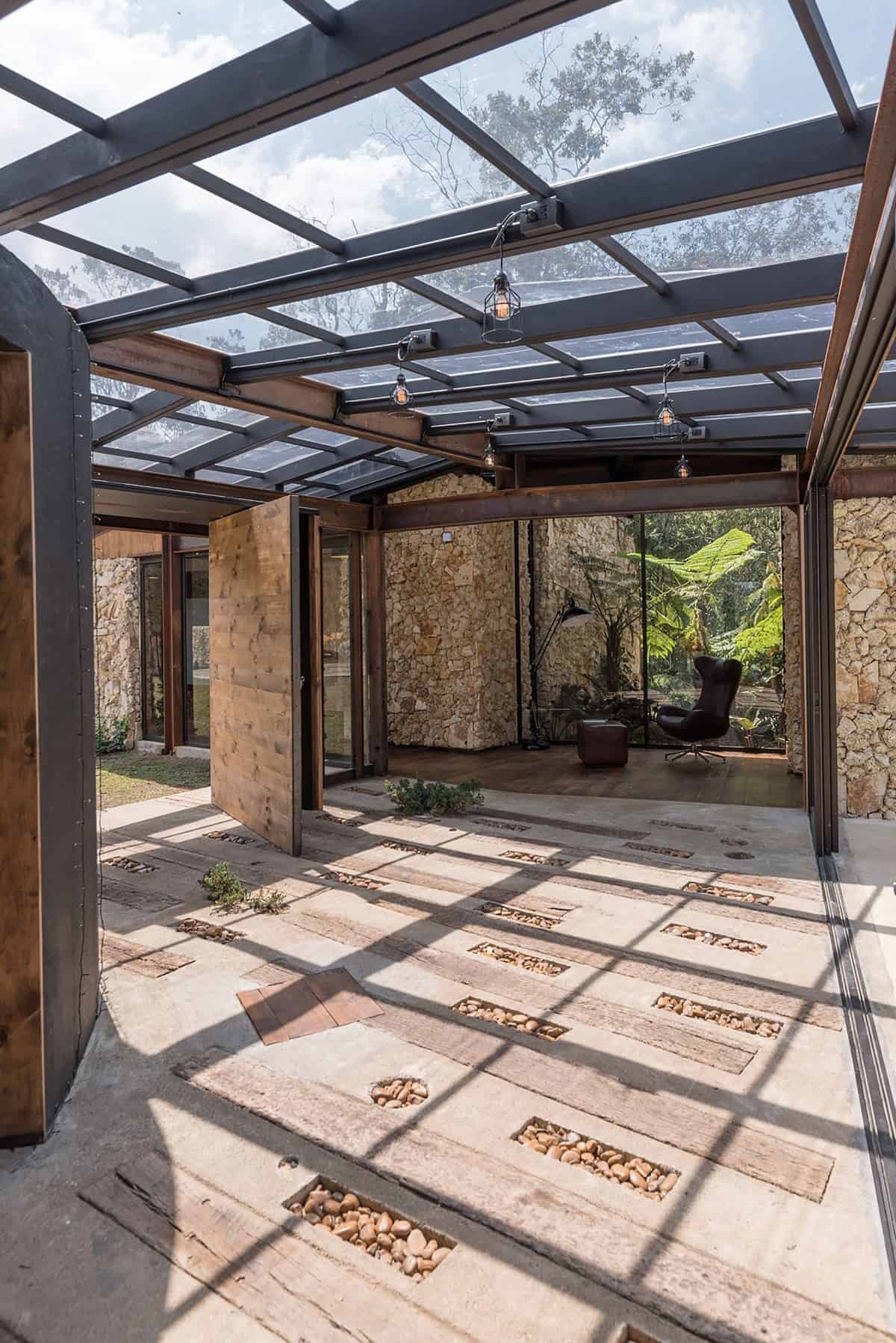 Skylights framed with black aluminum trims crown the corridor.