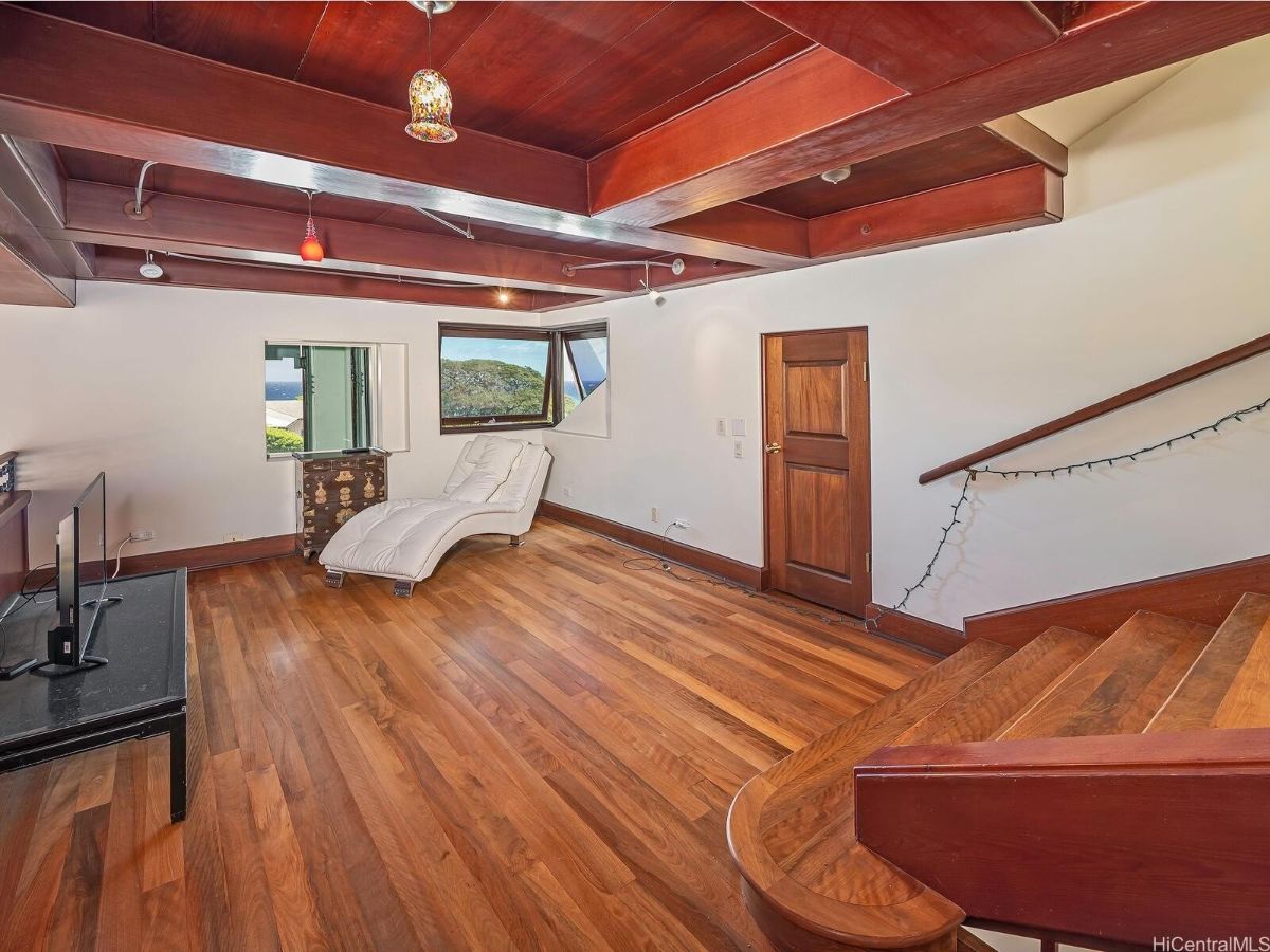 The outdoors features a wooden deck that overlooks the view of the mountain.