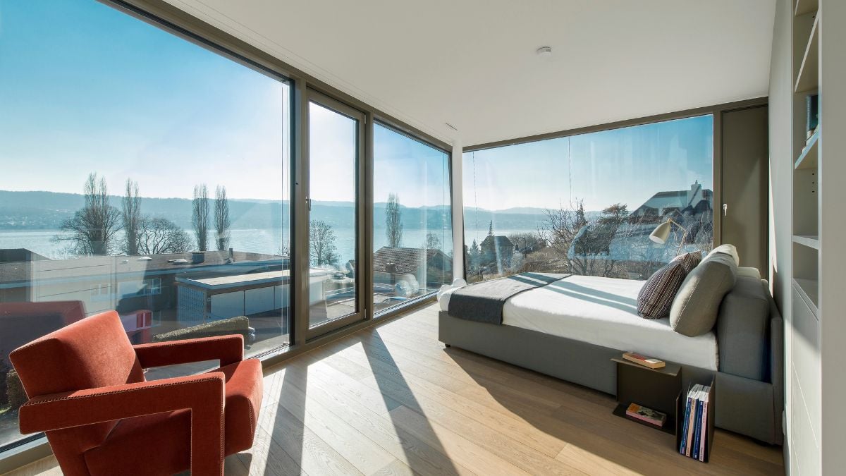 The bedroom has a west facing window where the sun sets.