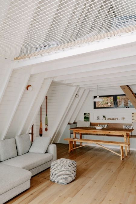 A picture of the living area that showcases the dining space within the house.