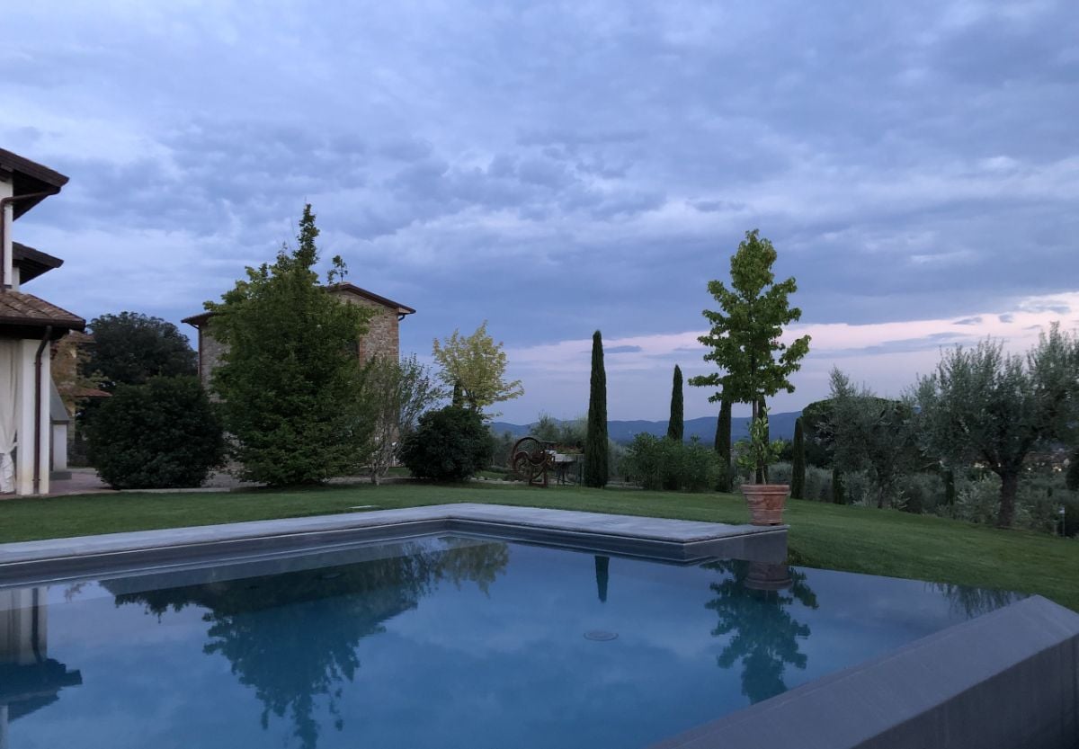 The house features a swimming pool with a view of the surrounding places.