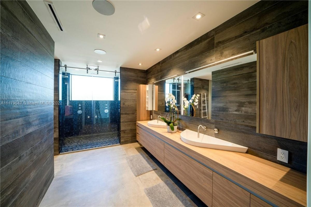 The master suite features a master bathroom with wooden floating vanity.