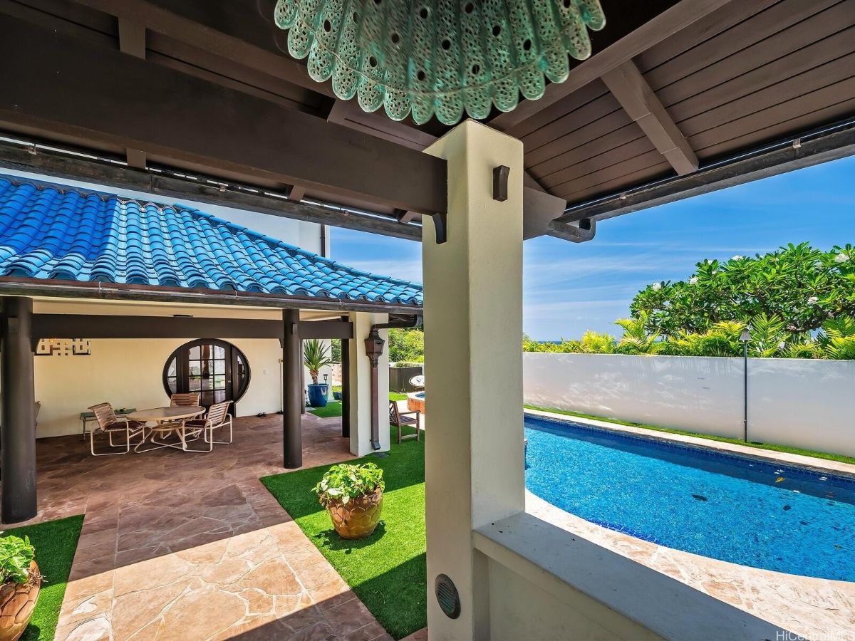 The swimming pool features a cocktail pool with a concrete deck.