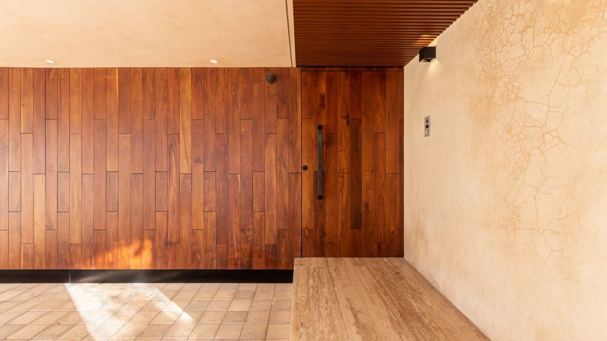 This photograph presents a close-up view of the large blind block that faces the street, captured from the inside of the house.