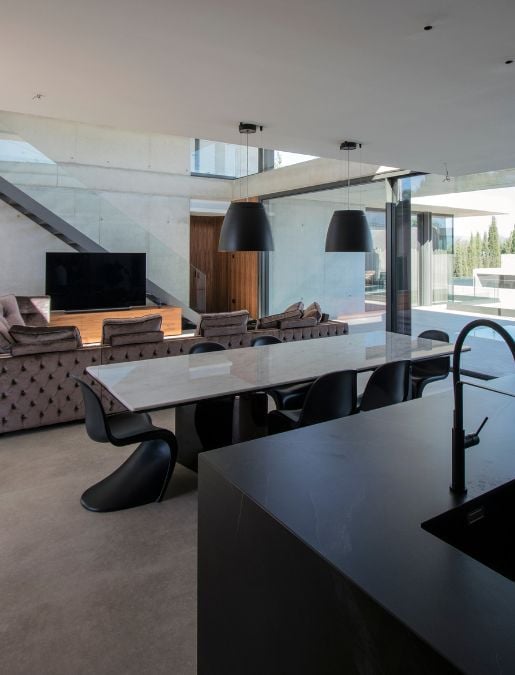 This image showcases the seamless integration of the dining, living, and kitchen areas, resulting in a cohesive and harmonious living space.