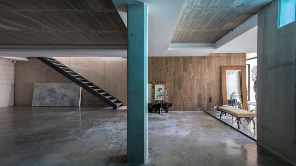 An interior photograph of a spacious living area devoid of furniture.