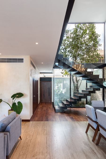 This photograph captures the way or approach to the staircase, offering a glimpse of the design and layout of the area.