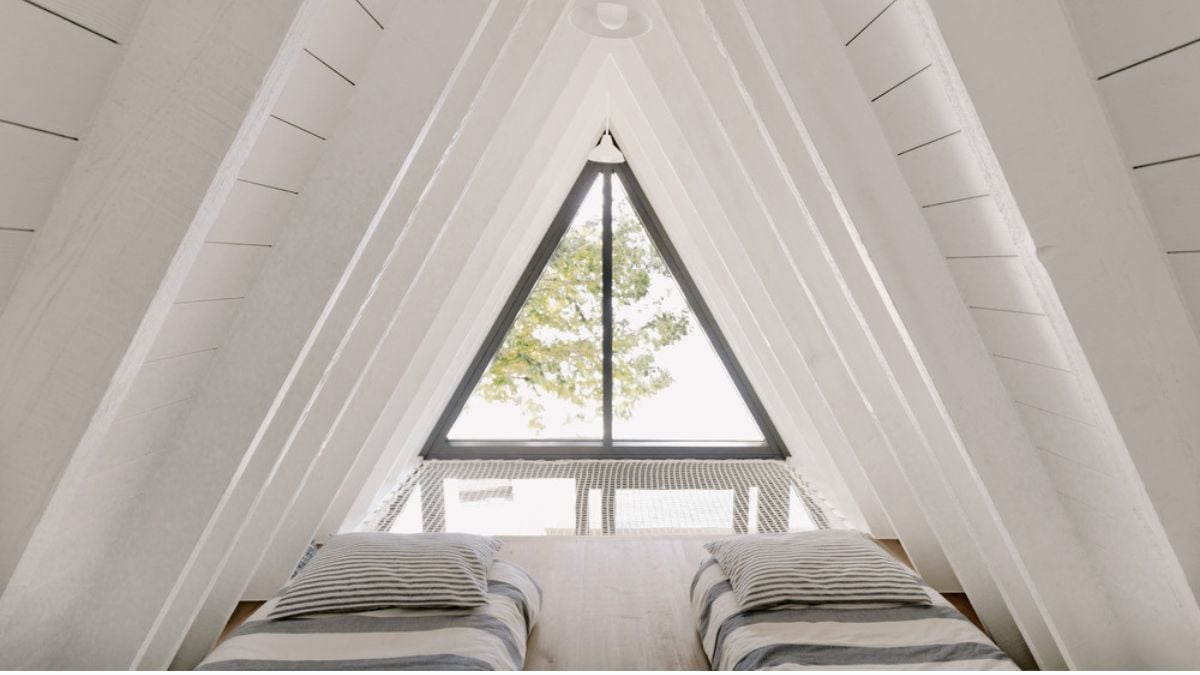 A picture of the bedroom space within the Chalet_A house, displaying a relaxing and cozy atmosphere.