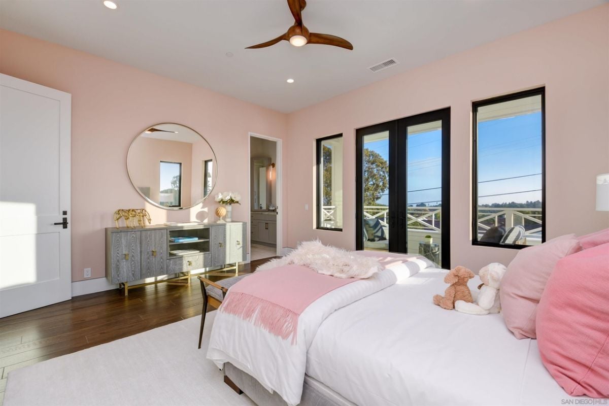 The bedroom features a glass door that leads to the balcony.