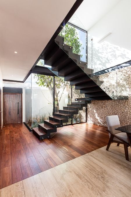 This photograph offers a close-up view of the staircase, allowing for a detailed appreciation of its intricate design and aesthetic features.