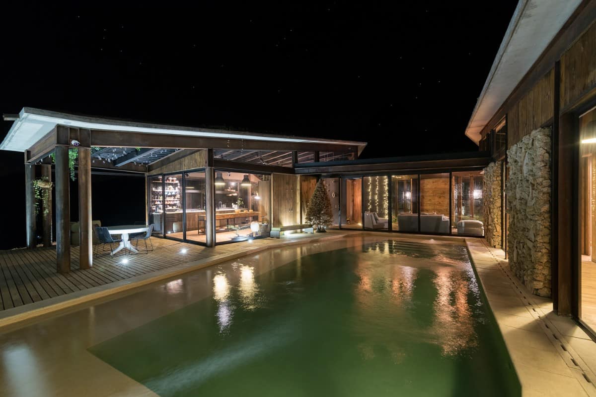 The pool deck also radiates a warm ambiance against the pitch black sky.