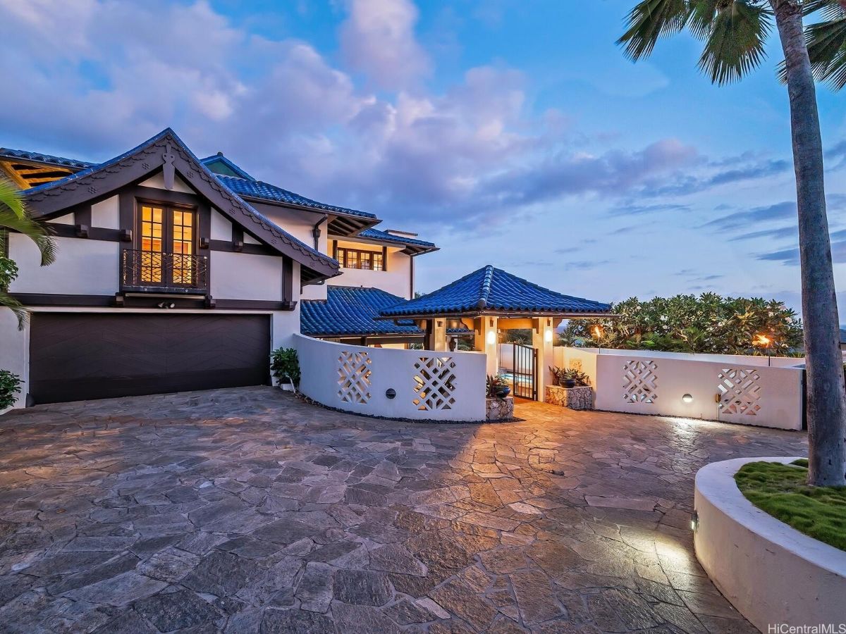 The entrance to the house features a stone pavement giving off a welcoming feel.