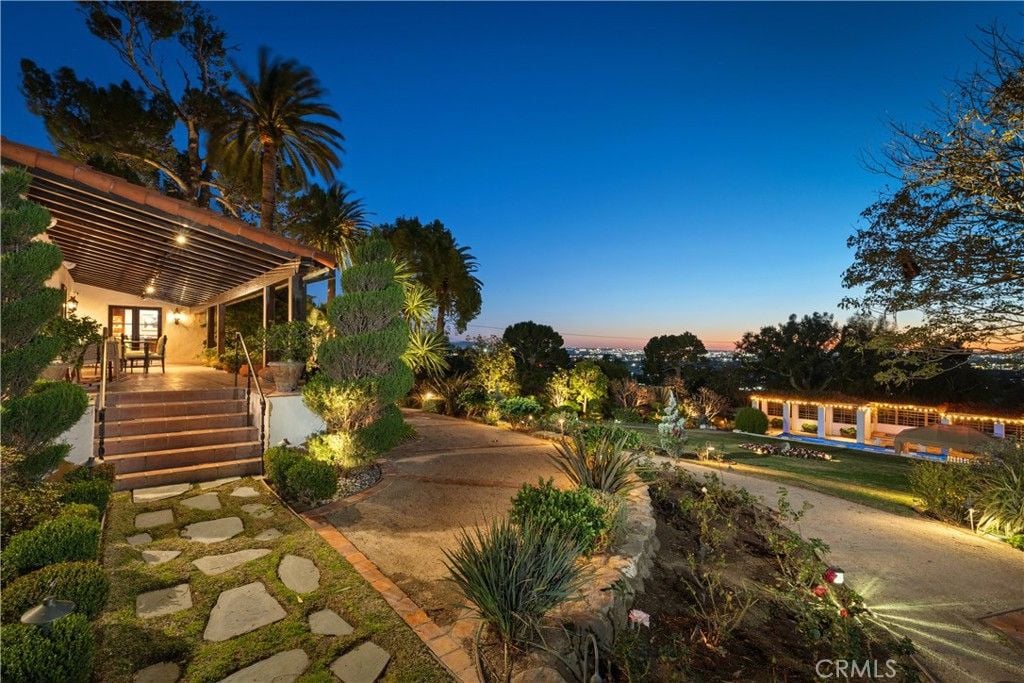 Stairs leading to the pergola and the swimming pool.