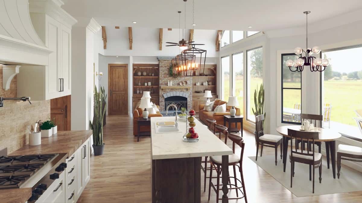 An open layout view of the kitchen, bayed dining nook, and a vaulted living room.