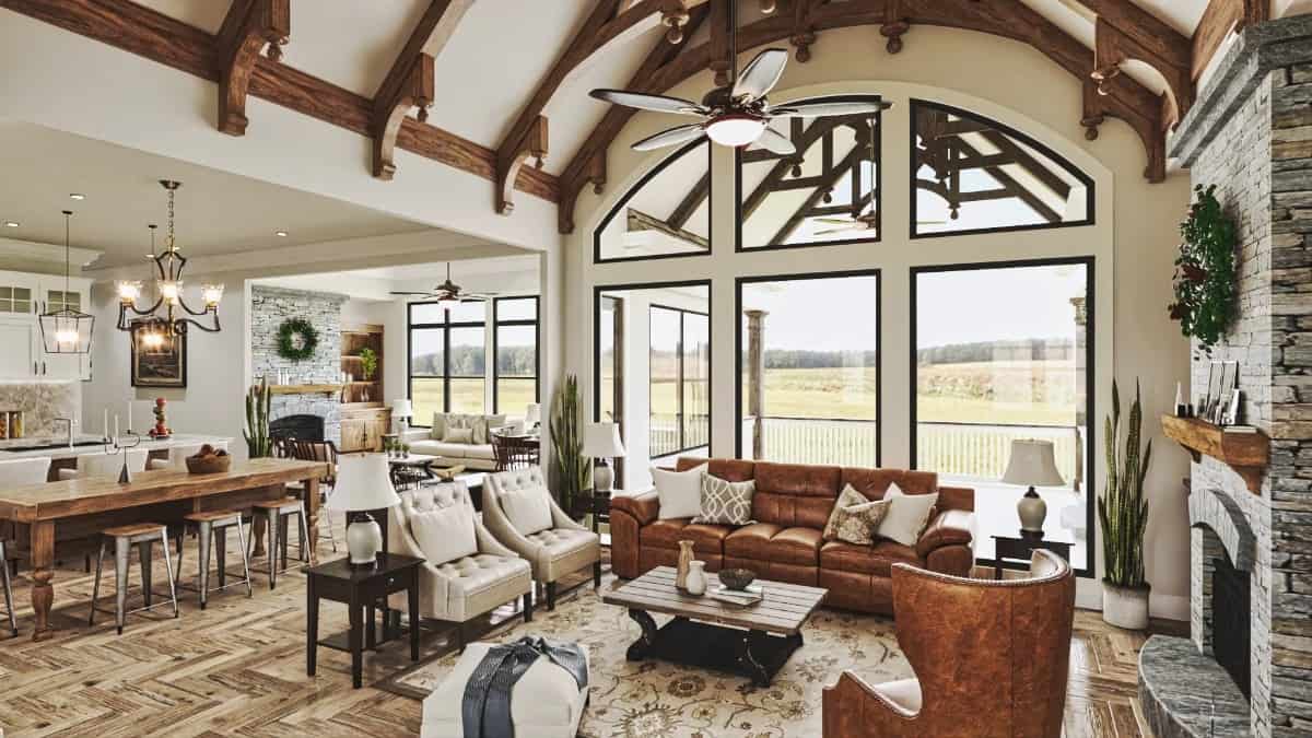 An open layout view of the vaulted lodge room, kitchen, and bright keeping room.