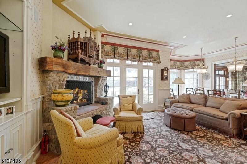 The house features a fireplace area with a sofa and coffee table.