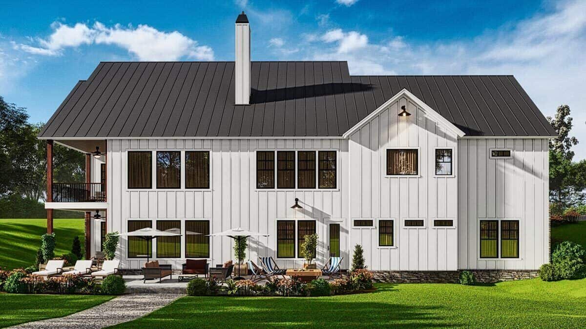 Rear rendering with board and batten siding, stone skirting, and tons of sleek windows.