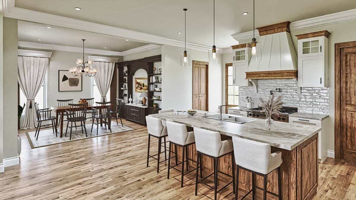 An oversized opening separates the dining room from the kitchen space.