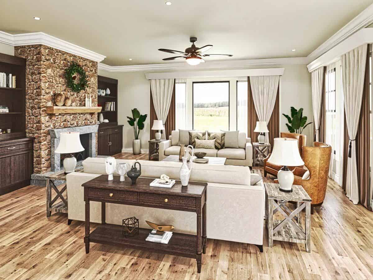 The living room offers modern seats and a stone fireplace flanked by dark wood built-ins.