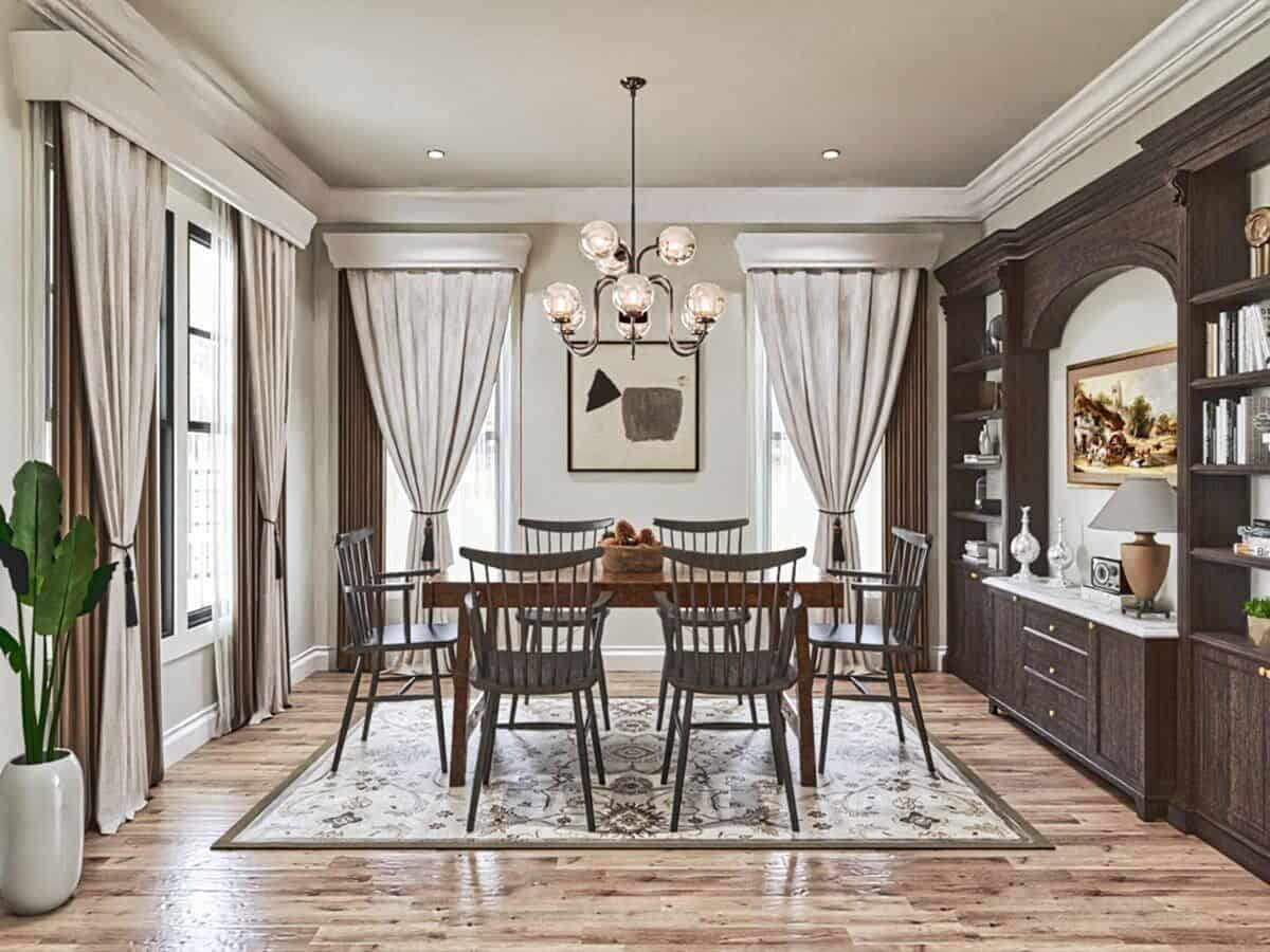 The formal dining room has a built-in buffet cabinet and a matching wooden dining set well-lit by a glass globe chandelier.