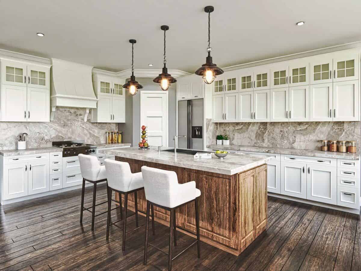 Kitchen with white cabinetry, a corner pantry, and a breakfast island with bar seating.