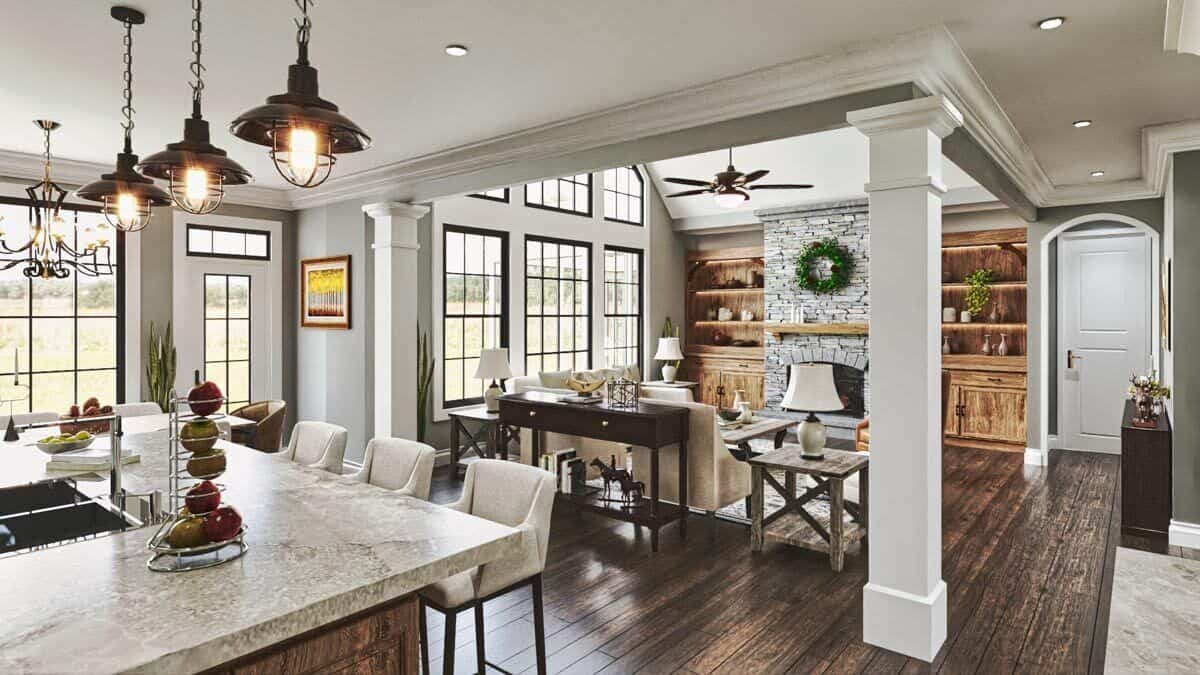 Interior columns separate the kitchen from the vaulted living room.