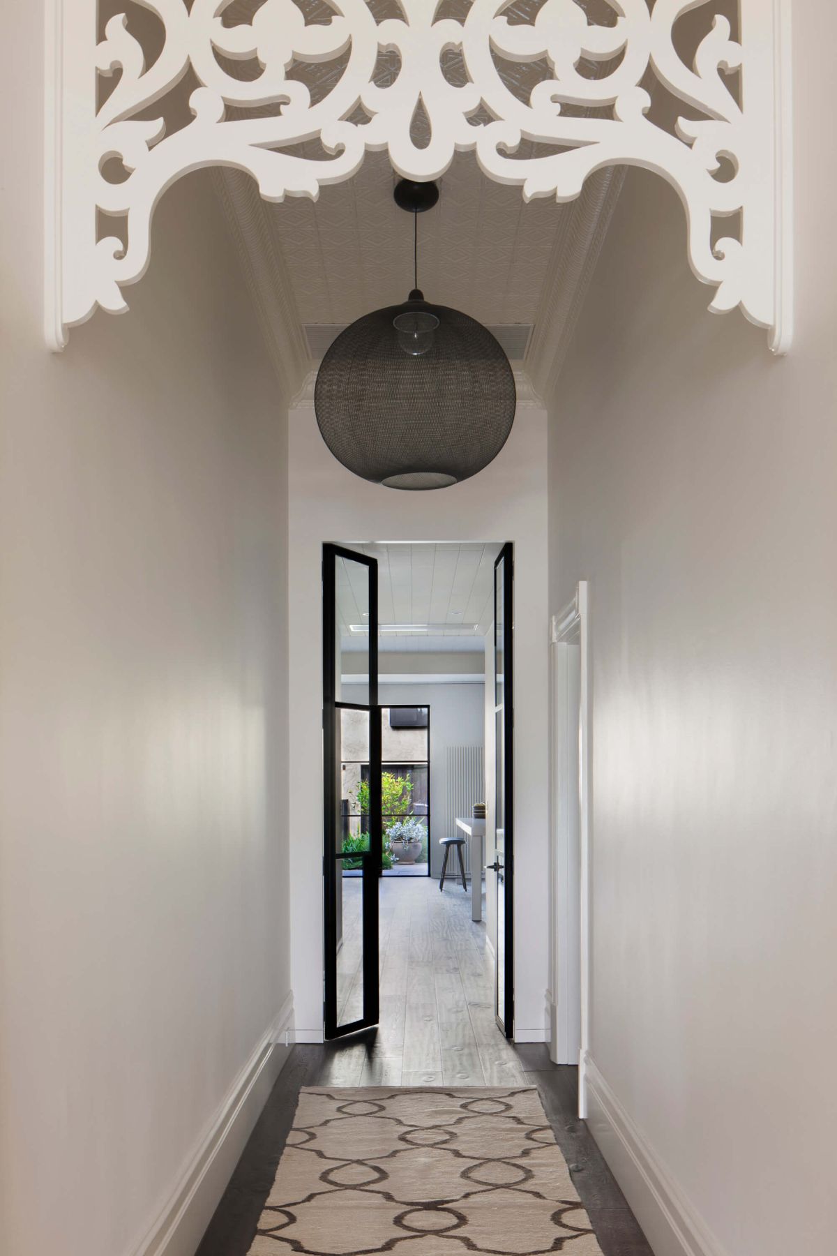 The entrance is a hallway leading to the living room.