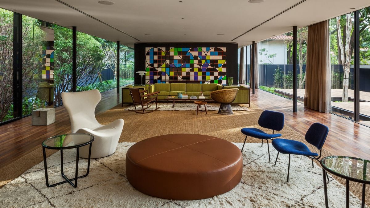 For the living space, the proportion and similar size of the sofas connect them. The space between the sofas gives the people in each set privacy.