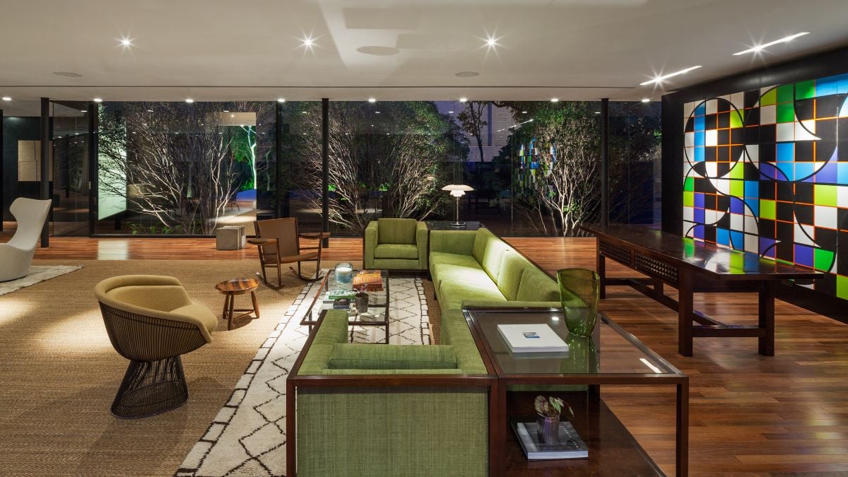 A closer inspection reveals small variations in the sofa designs as well as noticeable variations in the armchair designs. A rocking chair was placed in between the two sets in order to create a cozier relationship.
