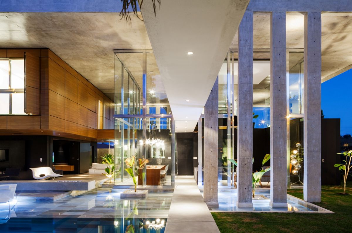 A modern house design with intermediate outside spaces separates the enclosed spaces.