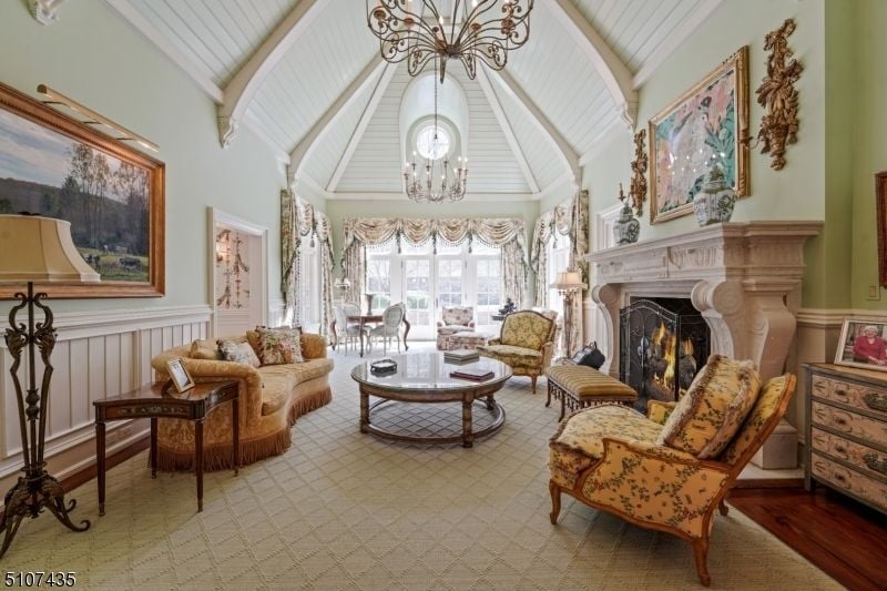 The living space features a fireplace with a cathedral ceiling giving the room a cozy feel.