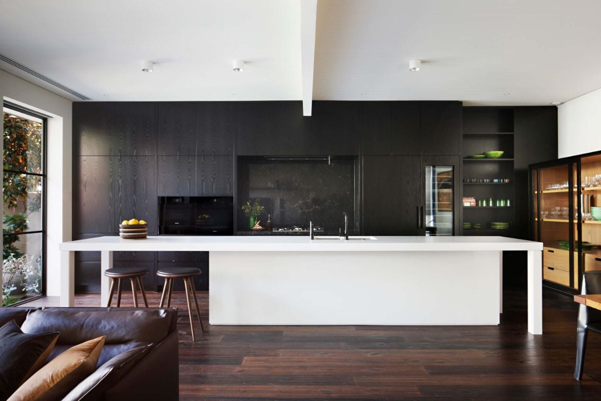 The kitchen features a bi-level kitchen island with a tile countertop.